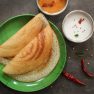 Dosa – South Indian Breakfast crepes served with chutney and sam Dosa - South Indian Breakfast crepes served with chutney and sambar, top view